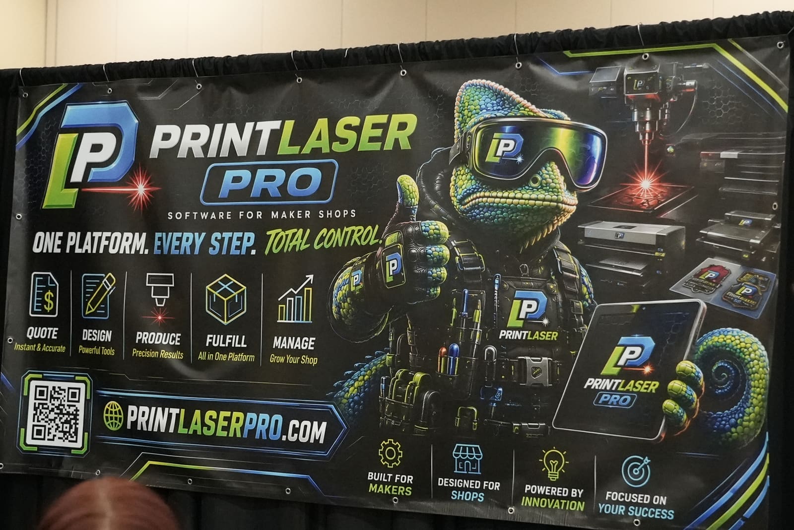 Print Laser Pro booth banner at Next Level Maker 2026, with the official Prizmo artwork and One Platform Every Step Total Control headline.