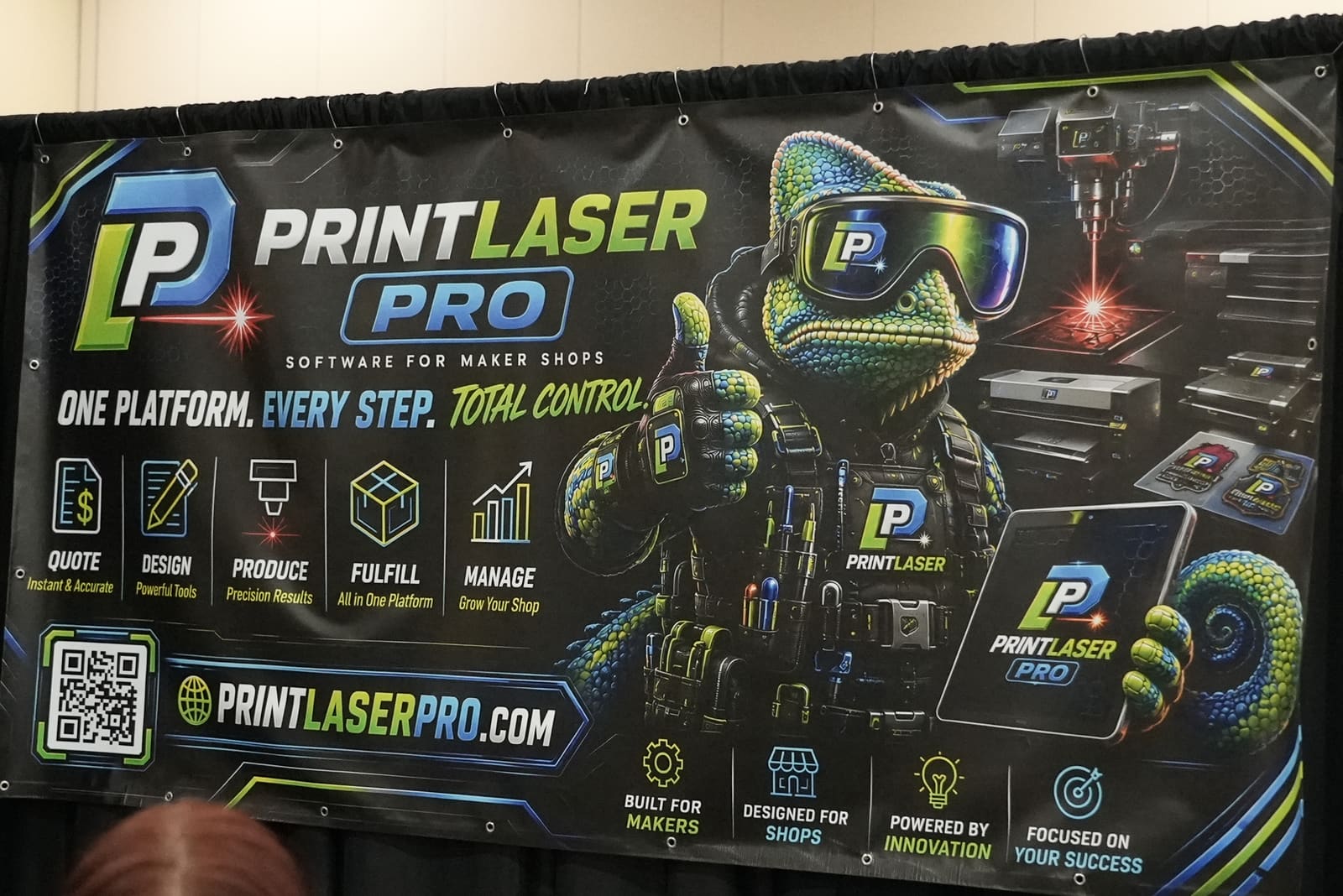 Print Laser Pro marketing wall at Next Level Maker 2026, showing the official Prizmo banner and workflow icons.